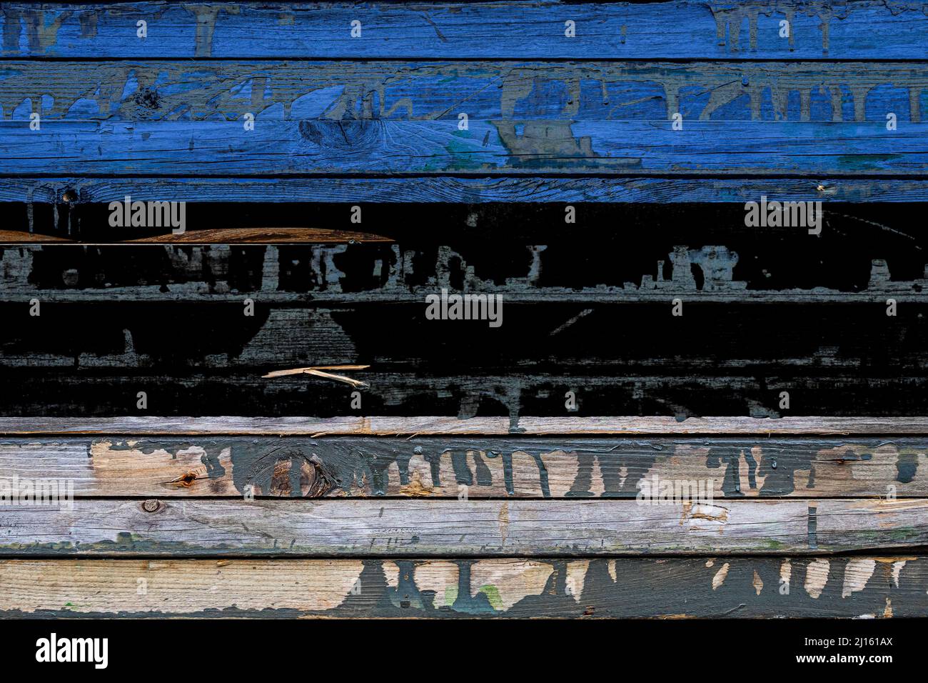The national flag of Estonia is painted on uneven boards. Country ...