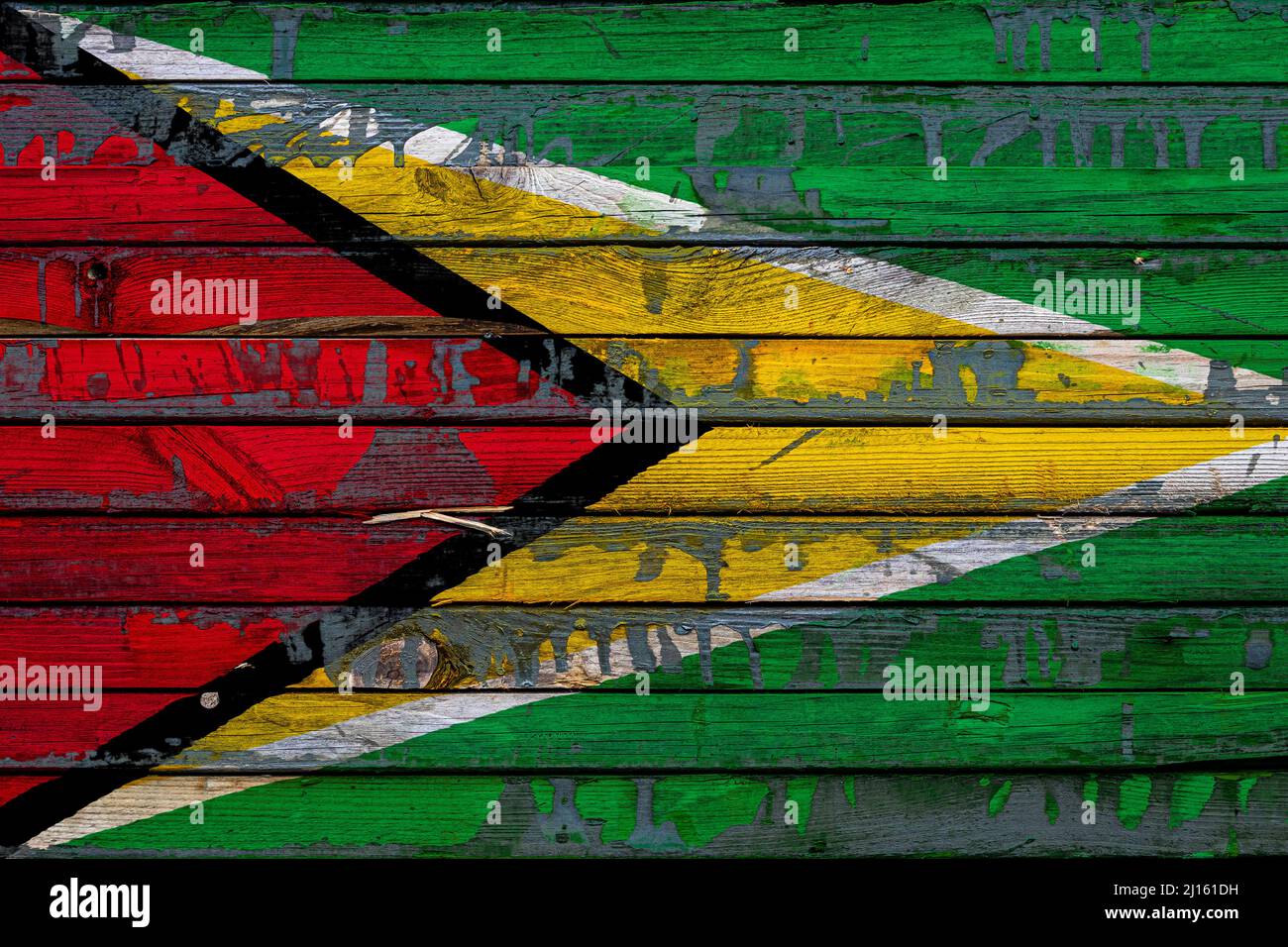 The national flag of Guyana is painted on uneven boards. Country symbol ...