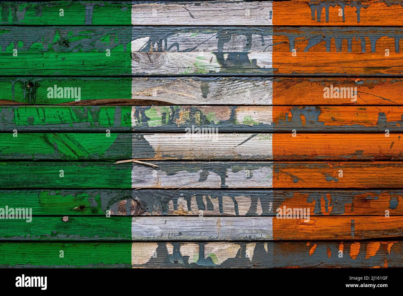 The national flag of Ireland is painted on uneven boards. Country ...