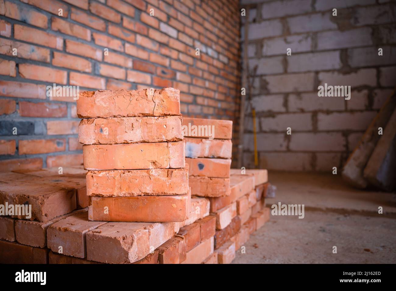 Red ceramic brick closeup stacked. building materials Stock Photo Alamy