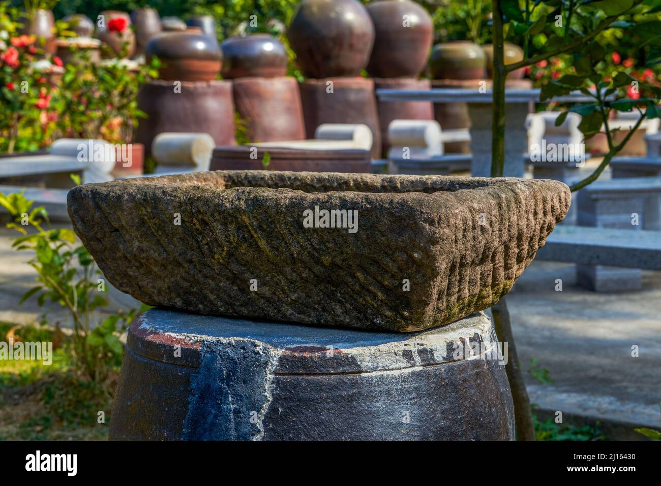 Stone flower pots for planting potted plants in a Chinese garden Stock