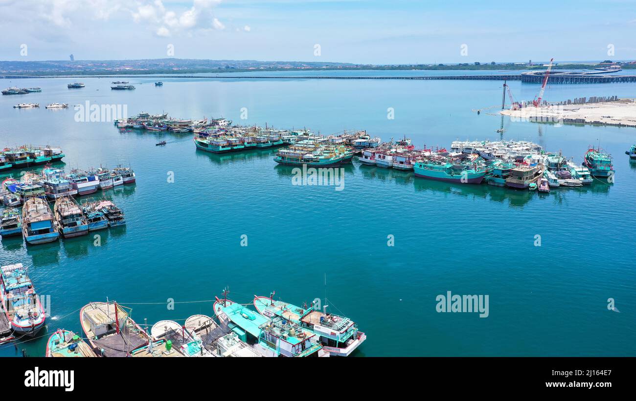 Aerial container terminal of Benoa Harbour with stacks of the boxes and a red command tower under light blue sky Stock Photo