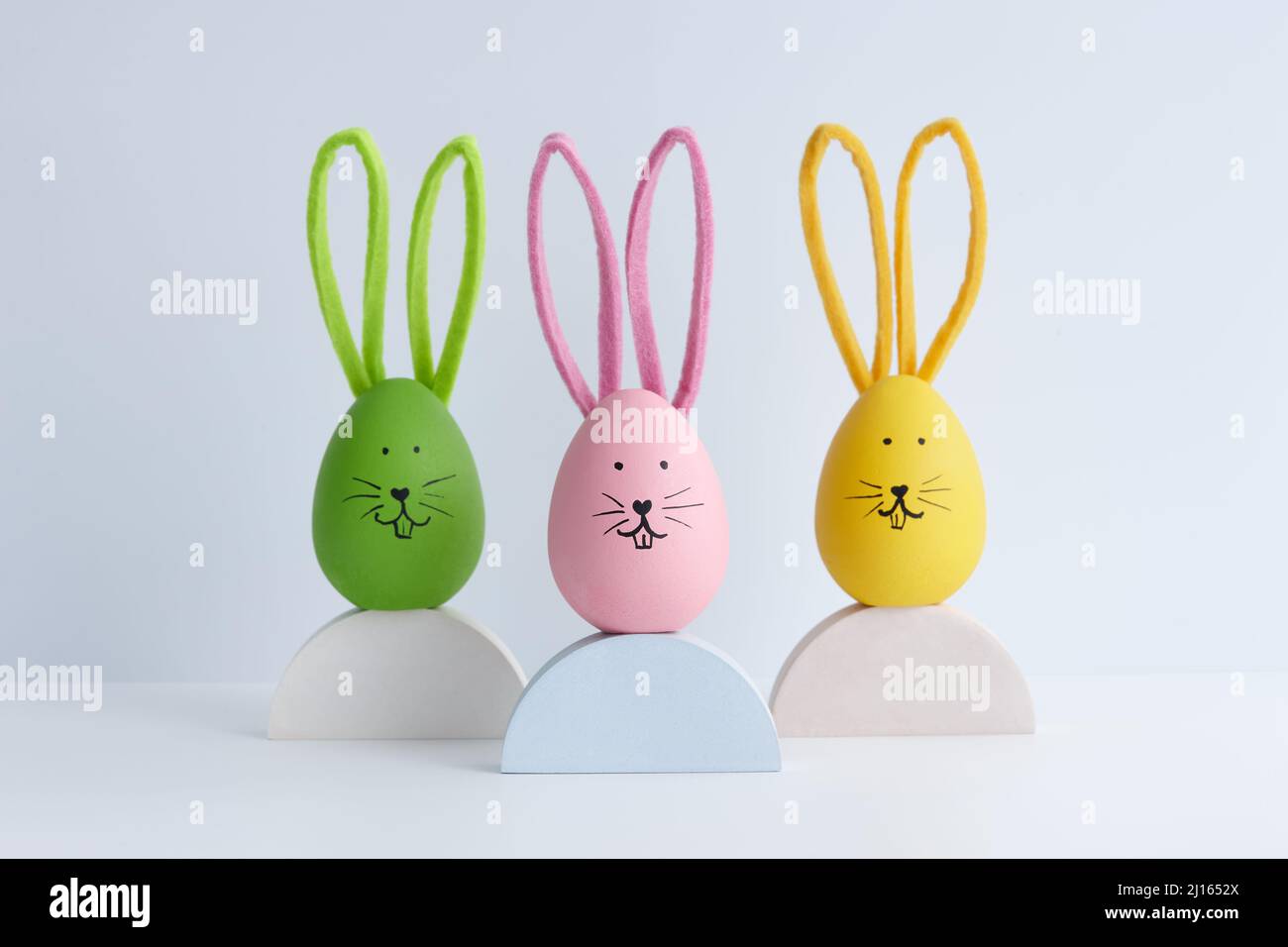 Colorful Easter eggs with bunny faces, holiday decoration Stock Photo