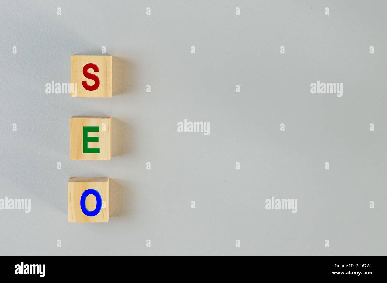 wooden cubes for SEO Search engine optimization  on gray background.Copy space. Stock Photo