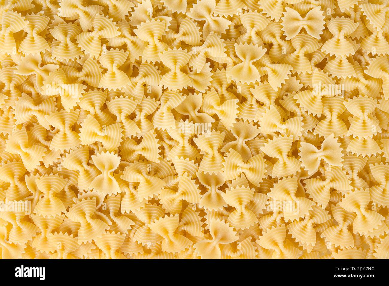 Dried bow tie pasta background Stock Photo