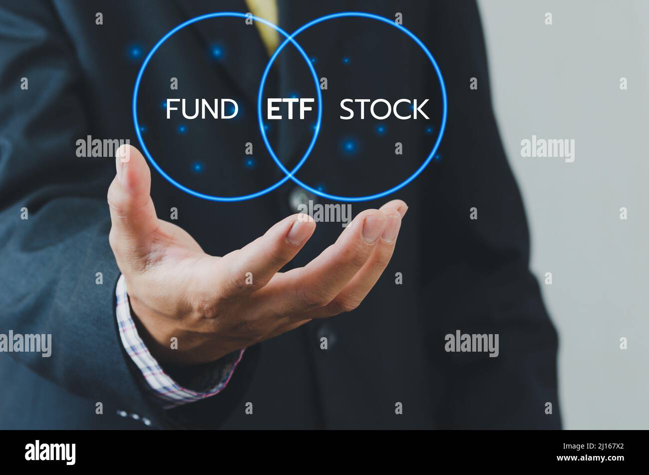 Hand businessman icon ETF Exchange Traded Fund virtual screen Internet Business stock market finance Index Fund Concept. Stock Photo