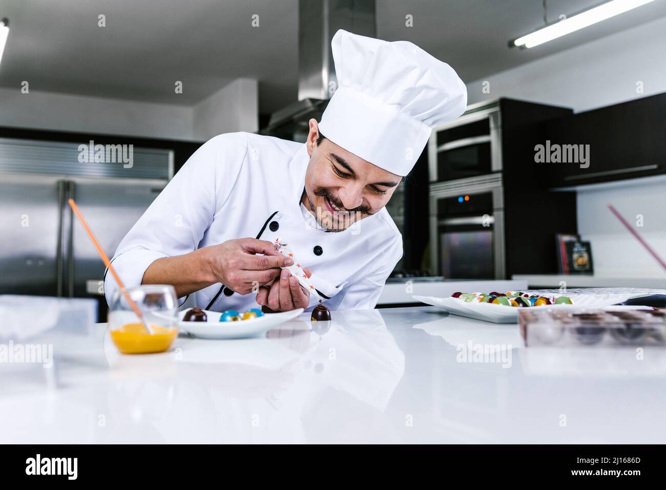 Chef hat chocolatier making hi-res stock photography and images - Alamy