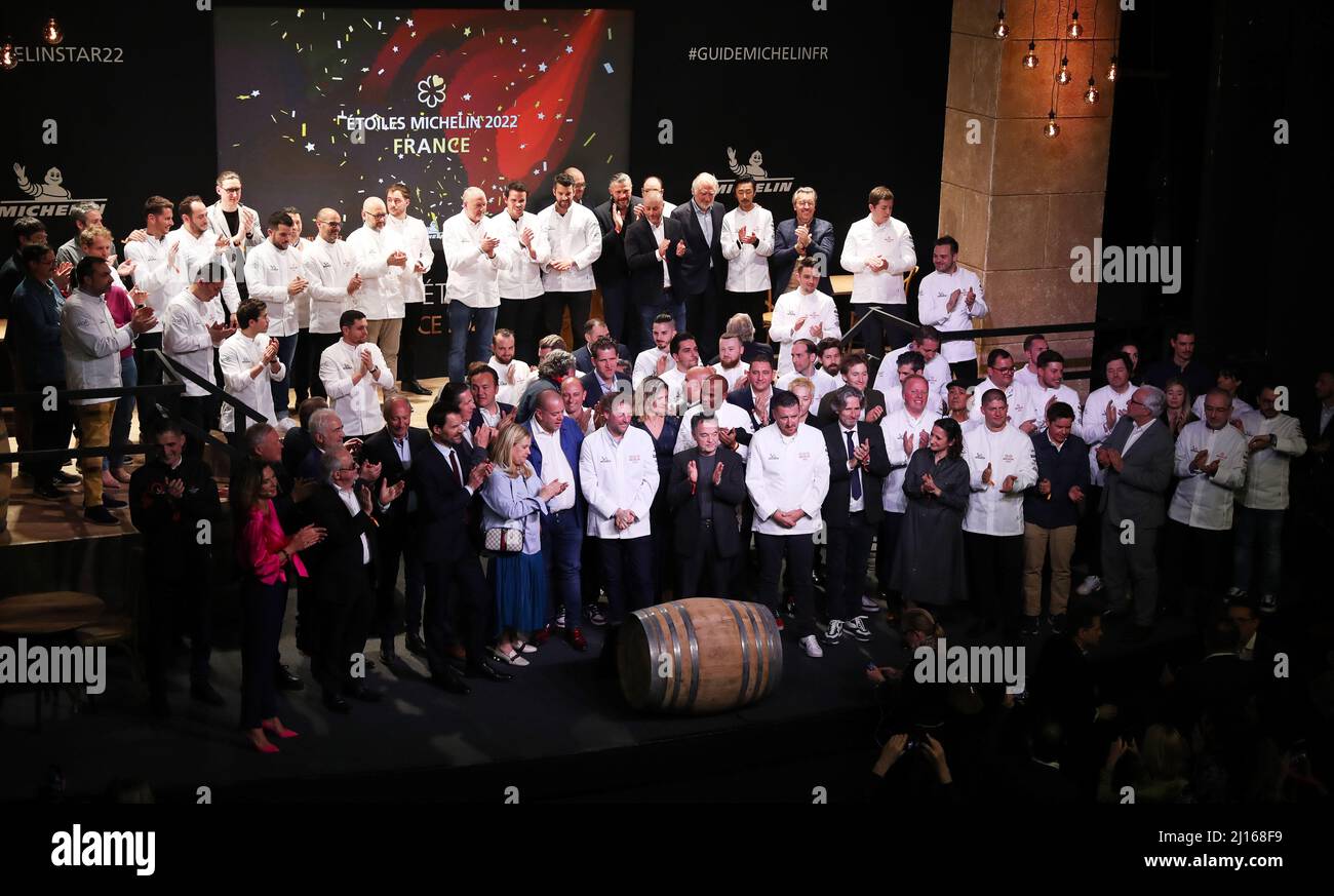 Cognac, France. 22nd Mar, 2022. Chefs celebrate after being awarded during the 2022 edition of the Michelin Guide award ceremony in Cognac, France, March 22, 2022. The Michelin Guide launched its 2022 edition on Tuesday in Cognac, the first time in its 122 years the ceremony has taken place outside Paris. Two restaurants were awarded the highest distinction of three stars. Credit: Gao Jing/Xinhua/Alamy Live News Stock Photo