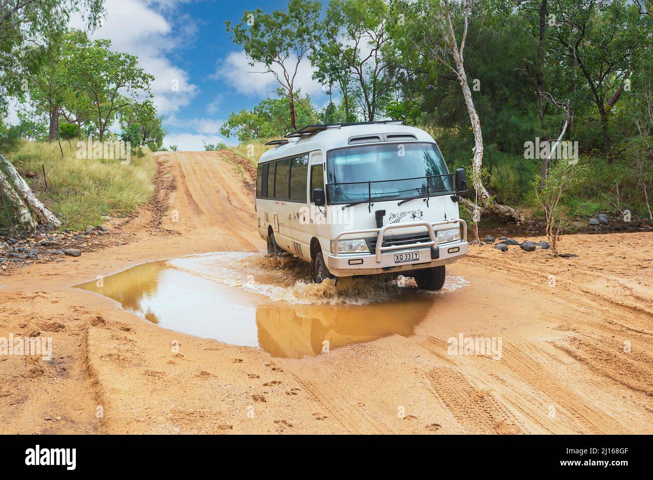 4WD Toyota Coaster Motorhome travelling off-road on a sandy track in Central Queensland, QLD, Australia Stock Photo