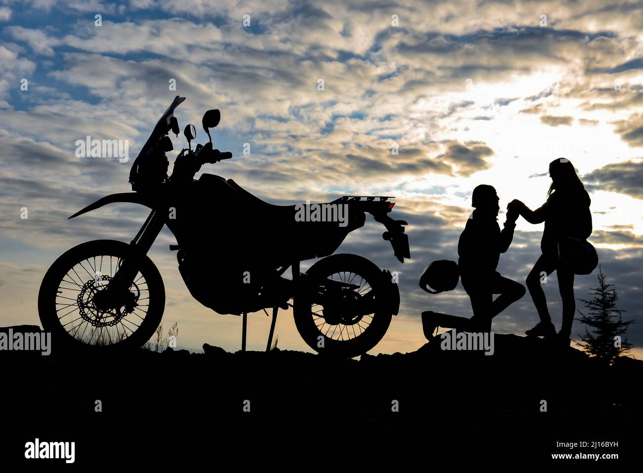 motorcyclist's marriage proposal and happiness concept Stock Photo