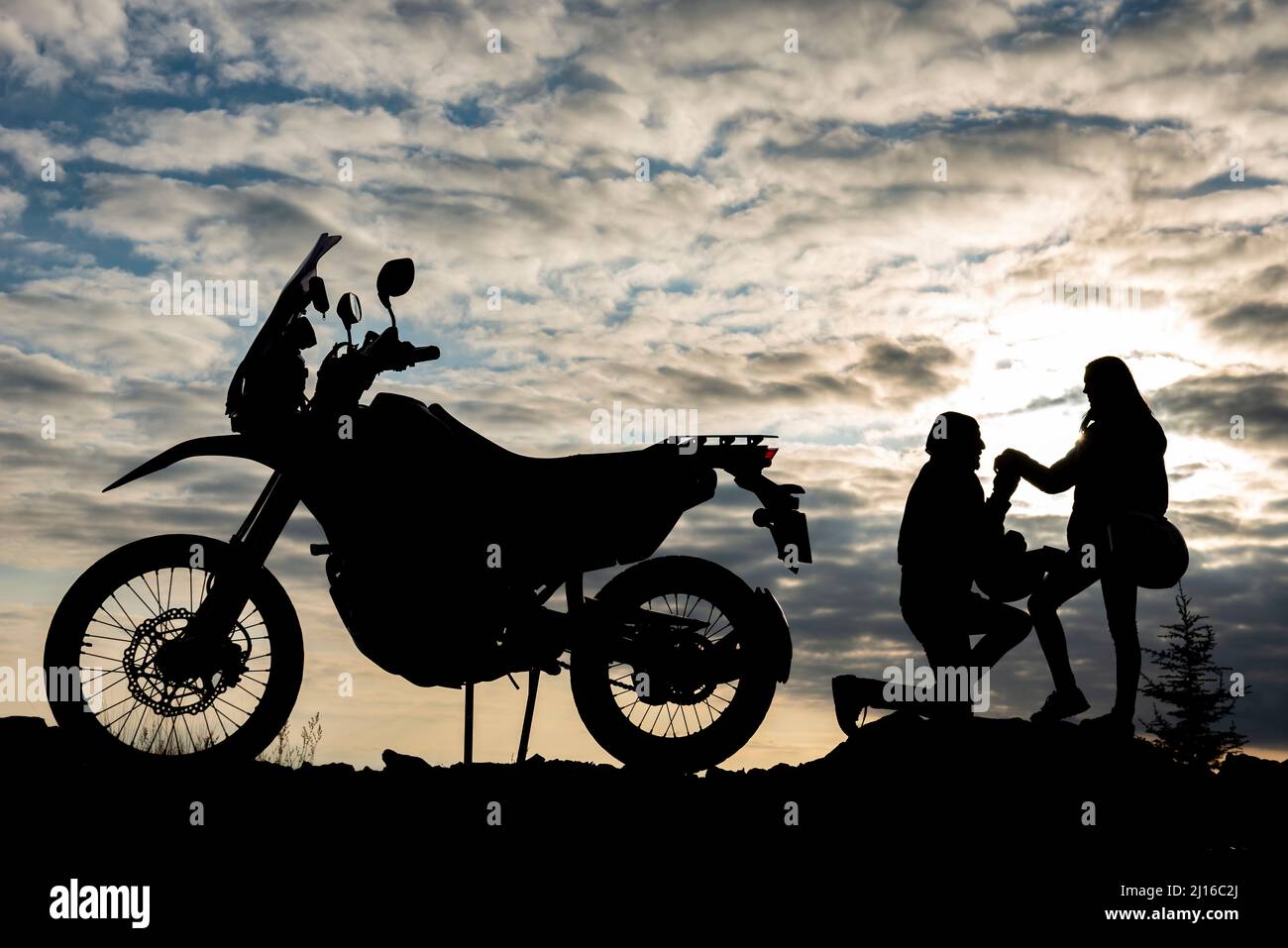 romantic marriage proposal for motorcyclist Stock Photo