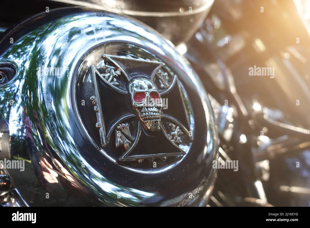 Chromed shiny skull on a motorcycle engine. Motorcycle part Stock Photo