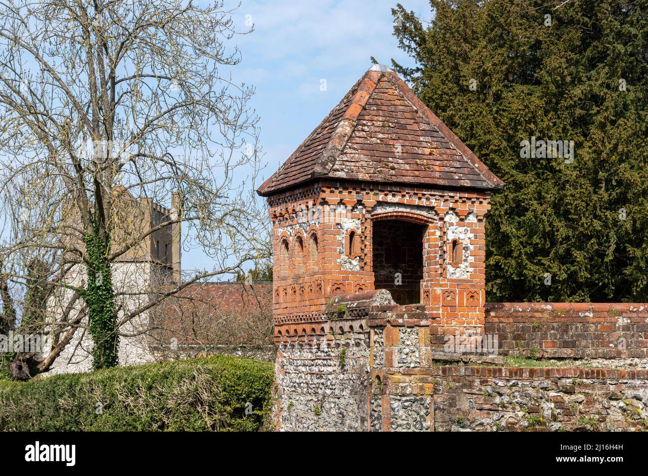 View of East Horsley village with Horsley estate architecture and the village church, Surrey