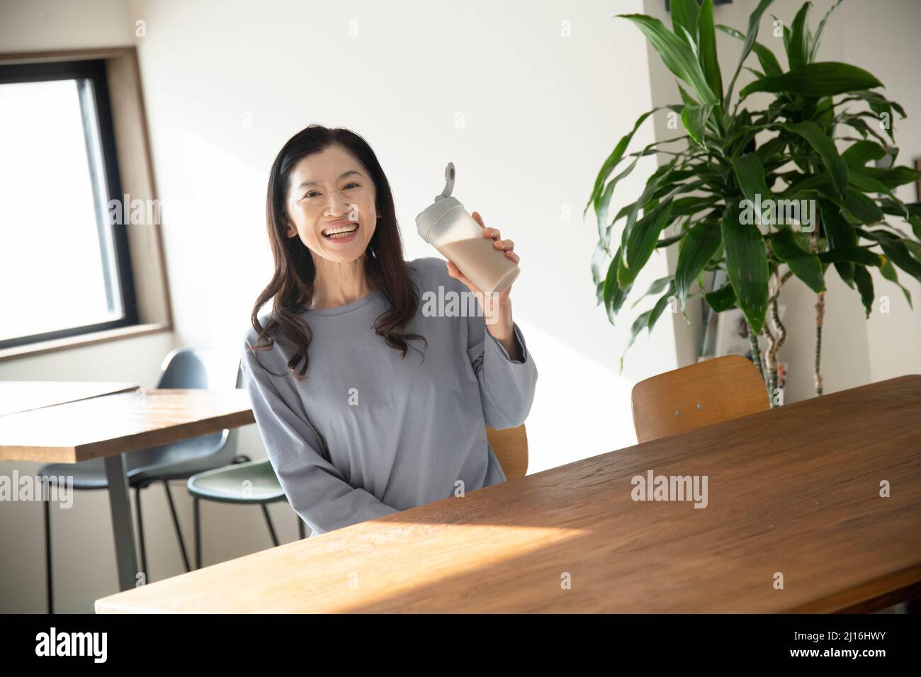Woman Drinking Protein Drink Stock Photo Alamy