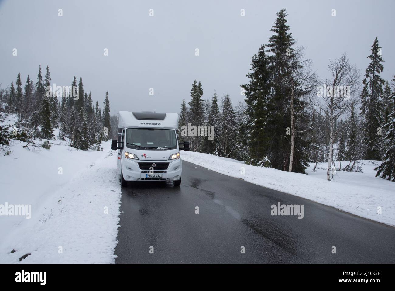 Campervan in snowy landscape of Telemark in Norway at the very beginning of May. Stock Photo