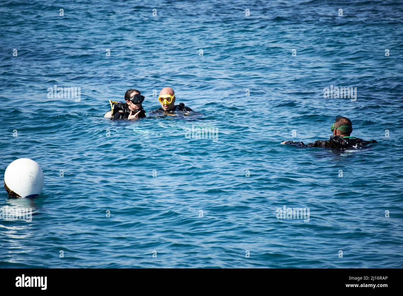 tourist group diving lesson in shallow water off the beach puerto del carmen lanzarote canary islands spain Stock Photo