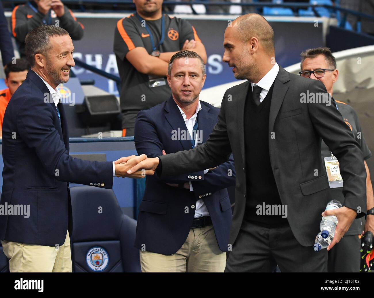 MANCHESTER, ENGLAND - AUGUST 24, 2016: City manager Josep Guardiola (R) greets FCSB official Mihai Stoica (L) prior to the second leg of the 2016/17 UEFA Champions League tie between Manchester City (Engalnd) and FCSB (Romania) at Etihad Stadium. Copyright: Cosmin Iftode/Picstaff Stock Photo
