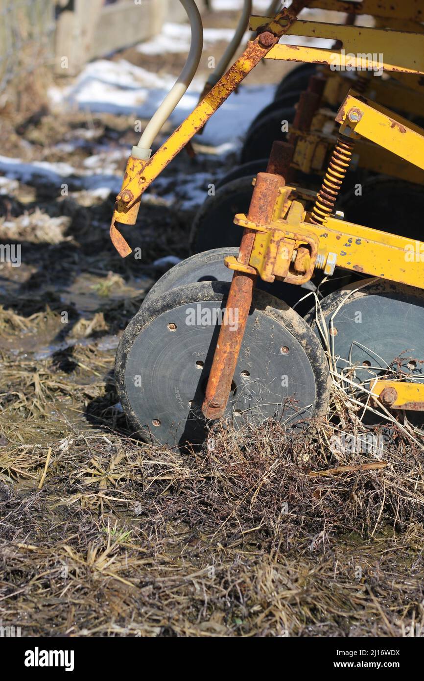 Old agricultural industrial equipment for tilling the soil Stock Photo