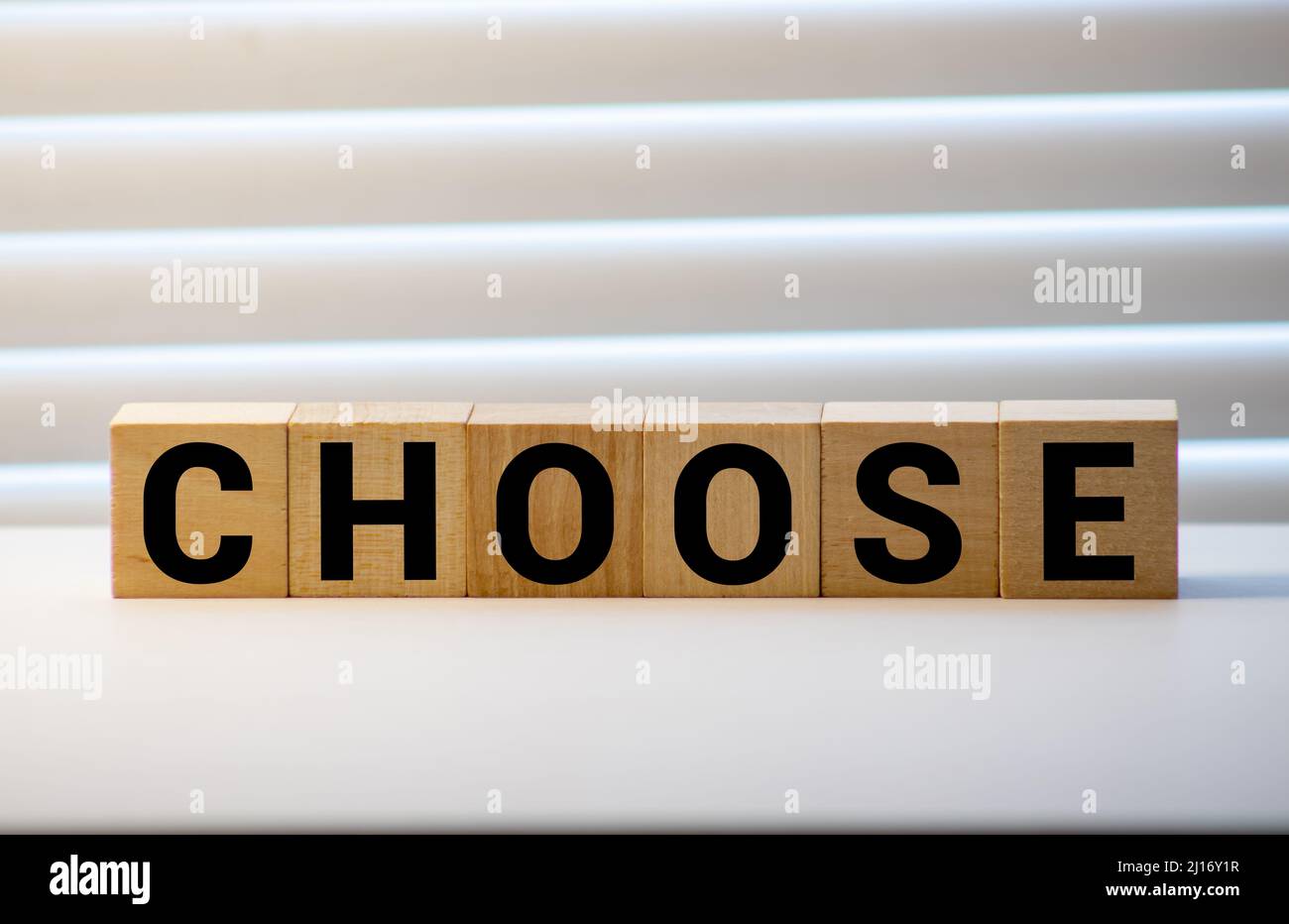 choose words from wooden blocks with letters, top view gray background
