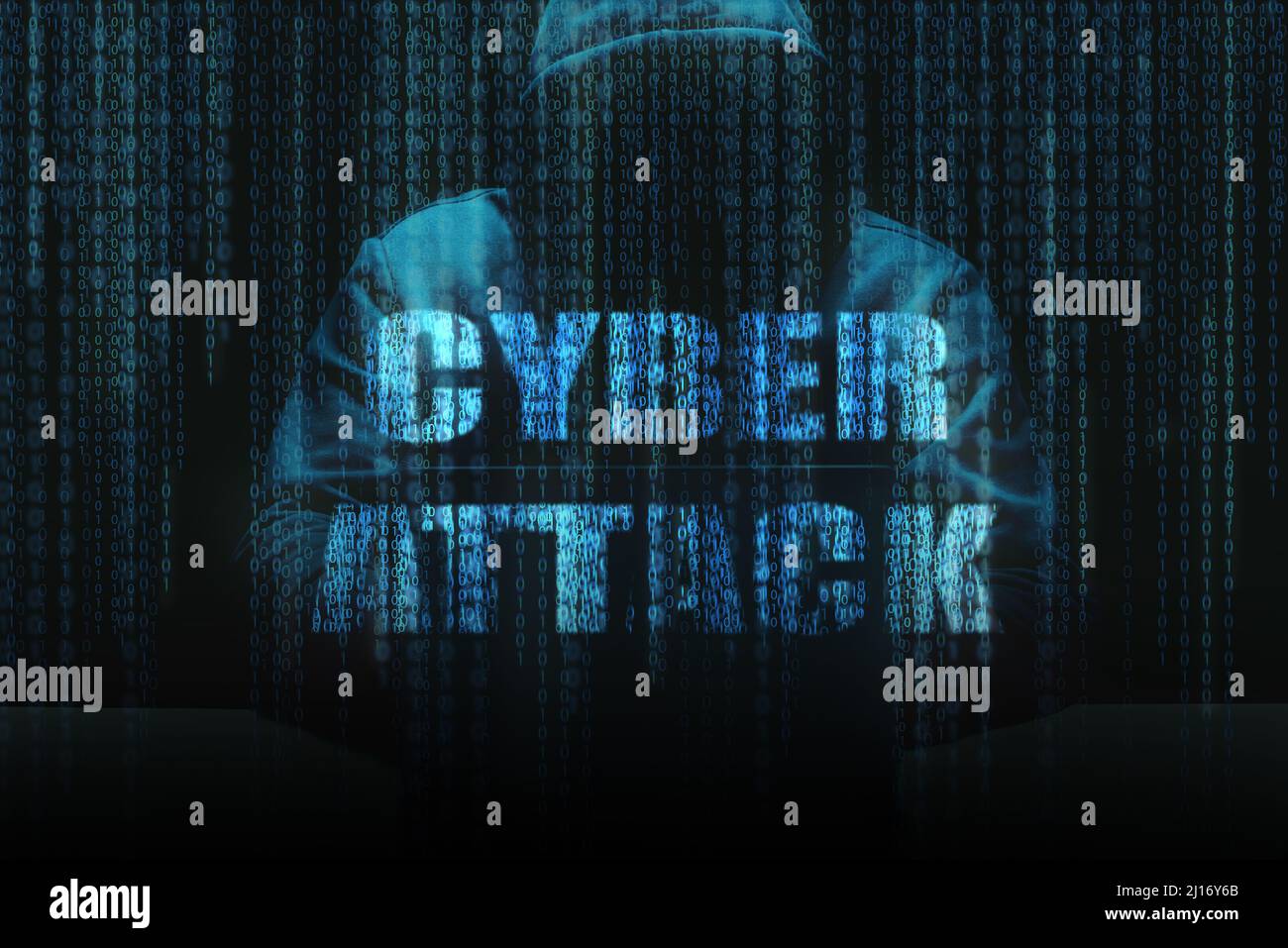 Unrecognizable person using a laptop computer with a hoodie with binary code layer and Cyber Attack written text Stock Photo