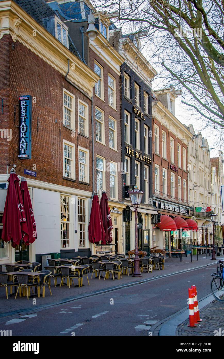 AMSTERDAM, NETHERLANDS. MARCH 19, 2022. Rembrandt square. Hotels and cafes in the city center. Stock Photo