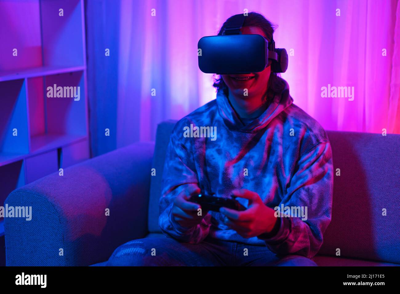 Metaverse technology concept, Man wear VR goggles and using joystick to ...