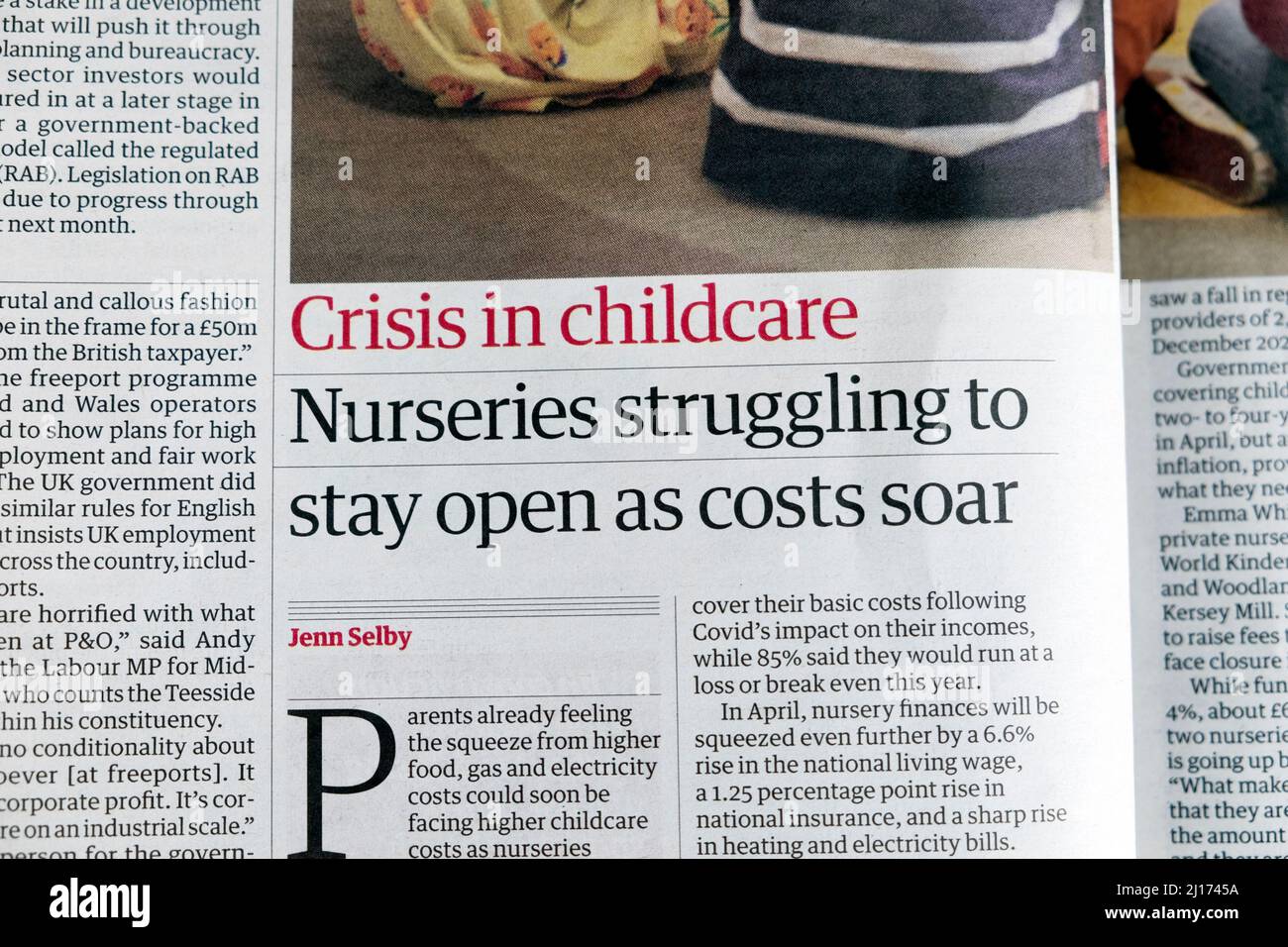 'Crisis in childcare Nurseries struggling to stay open as costs soar' Guardian newspaper headline children article 22 March 2022 in London England UK Stock Photo