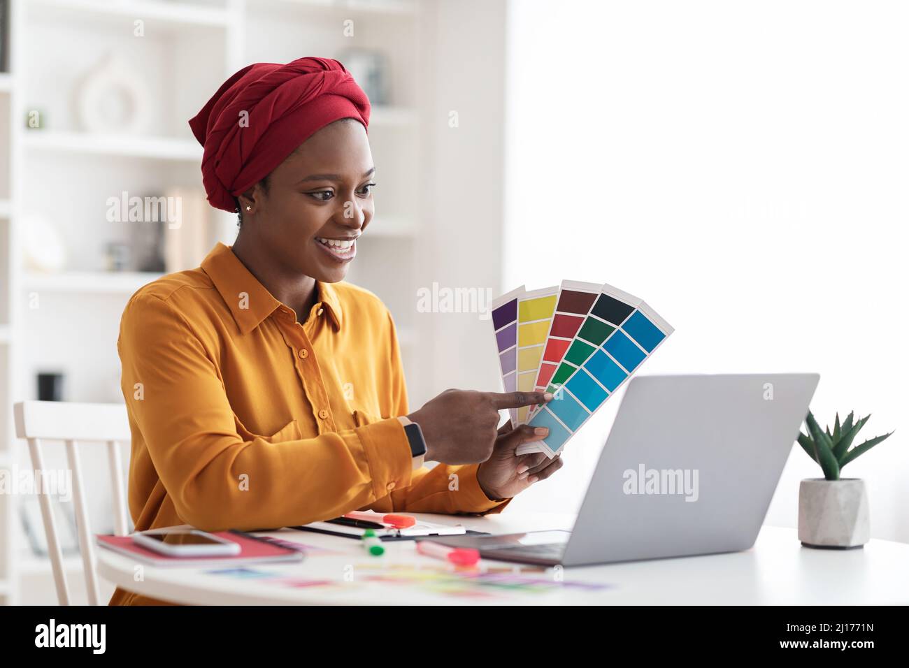 Stylish young black woman independent contractor having video conference Stock Photo
