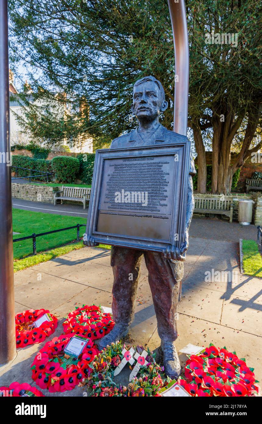 Remembrance statue of a man holding a list of fallen inscribed 'We Will Remember Them', Guildford Castle Grounds, Guildford, Surrey, southeast England Stock Photo