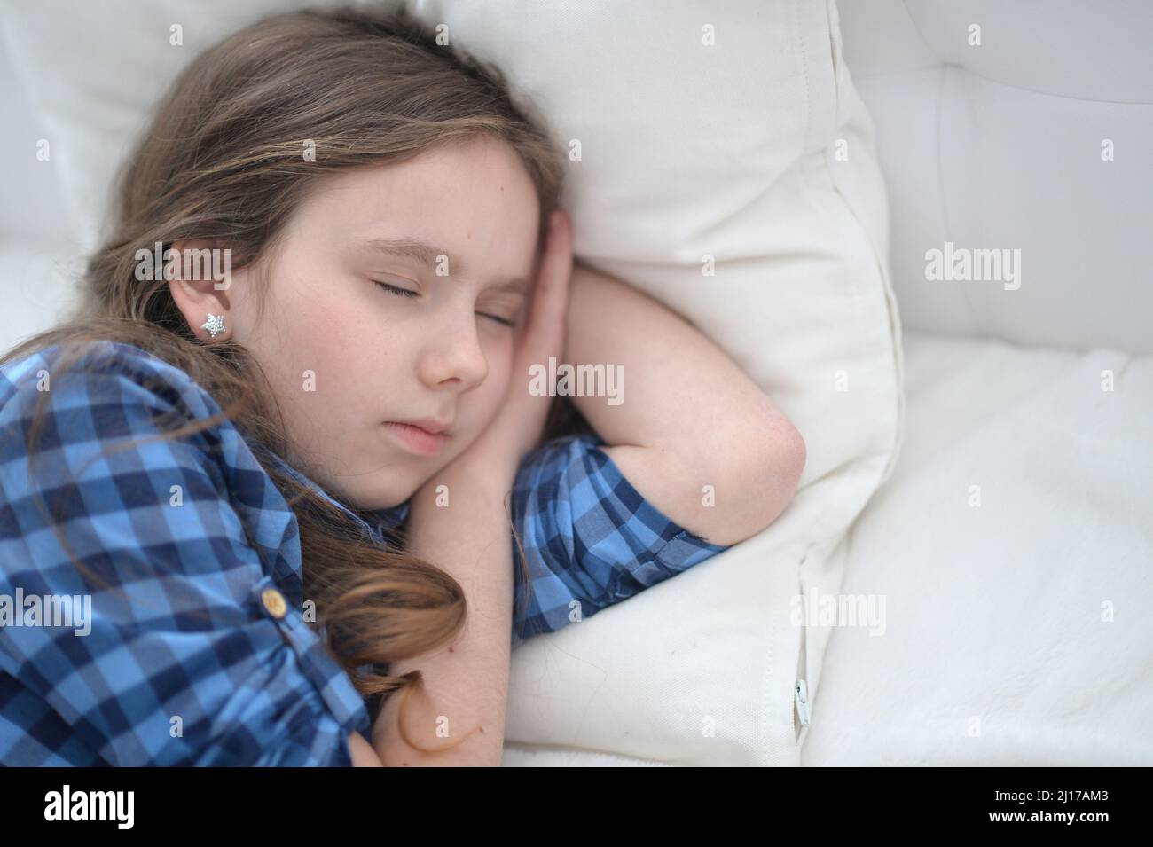 Cute little girl sleeping in bed at home Stock Photo Alamy