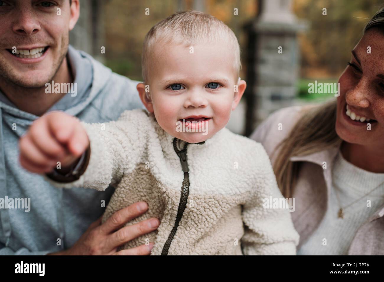 Blond boy with mother and father Stock Photo