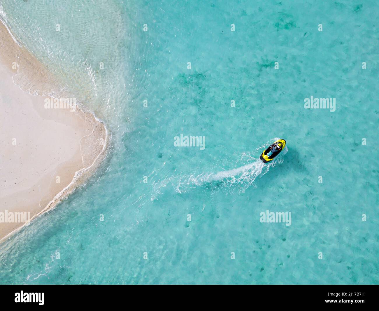 Man driving personal watercraft in sea Stock Photo