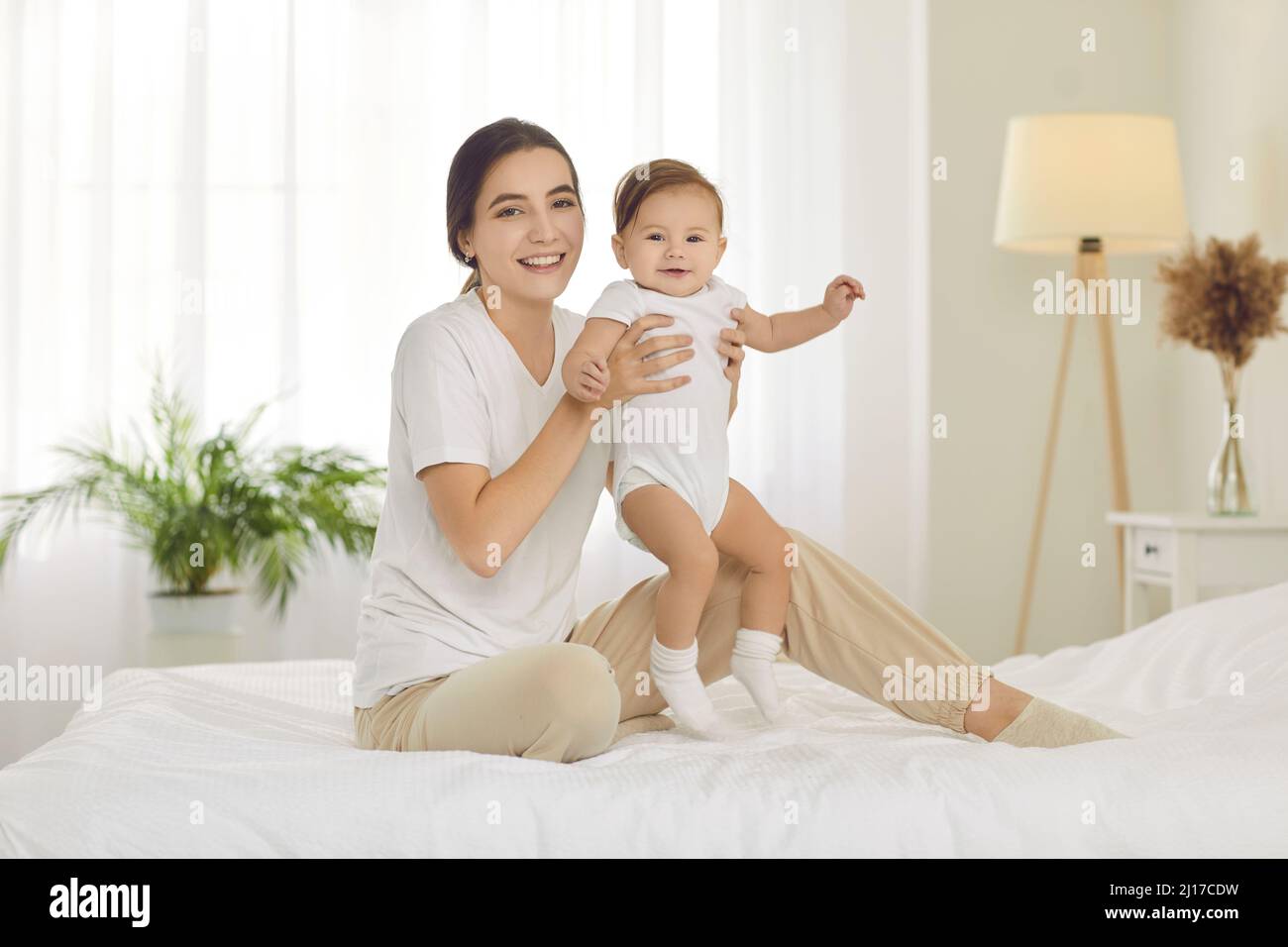 Portrait of happy mother with newborn baby infant Stock Photo