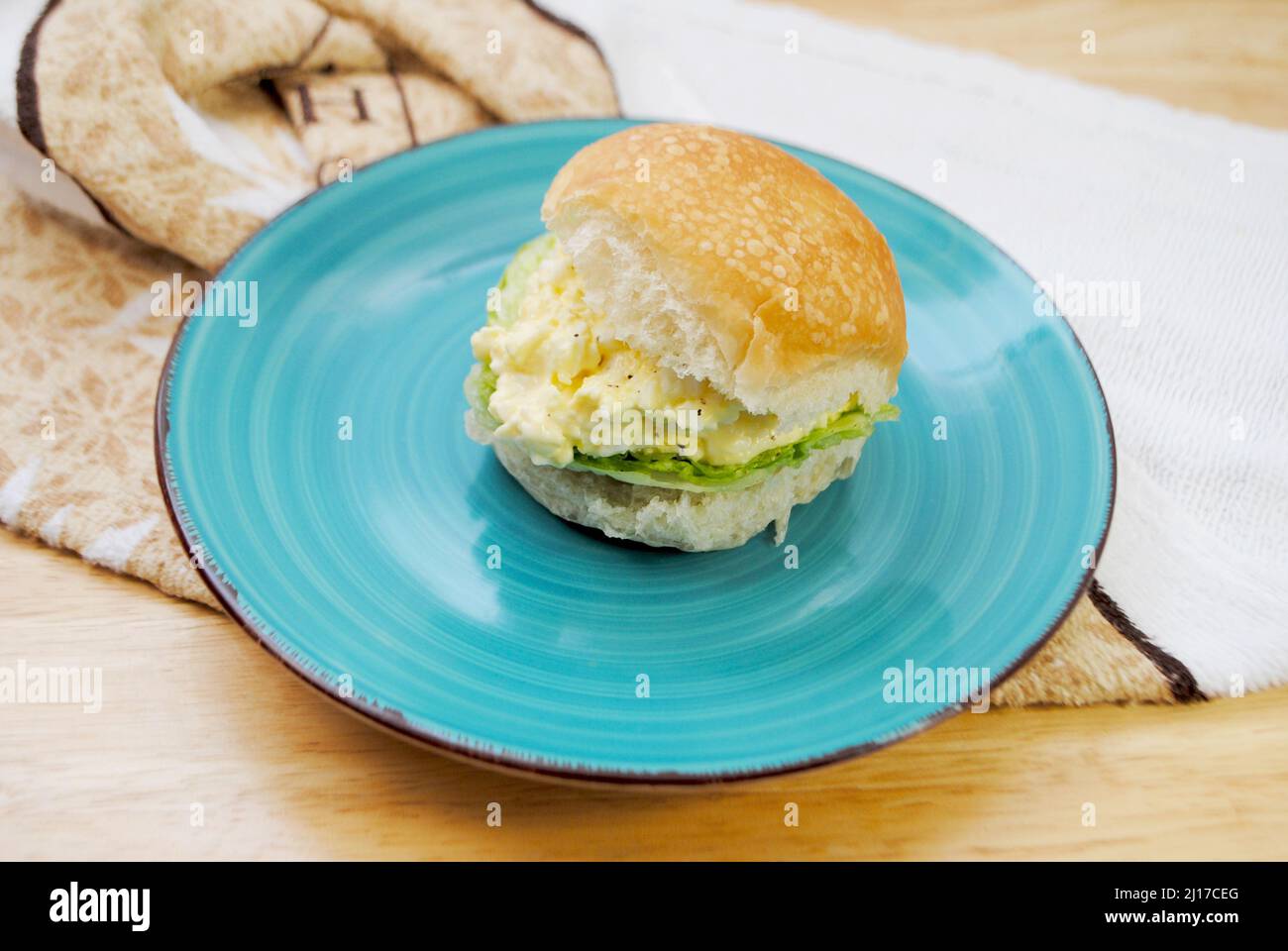 A Slider Egg Salad Sandwich with Lettuce Served on a Plate Stock Photo