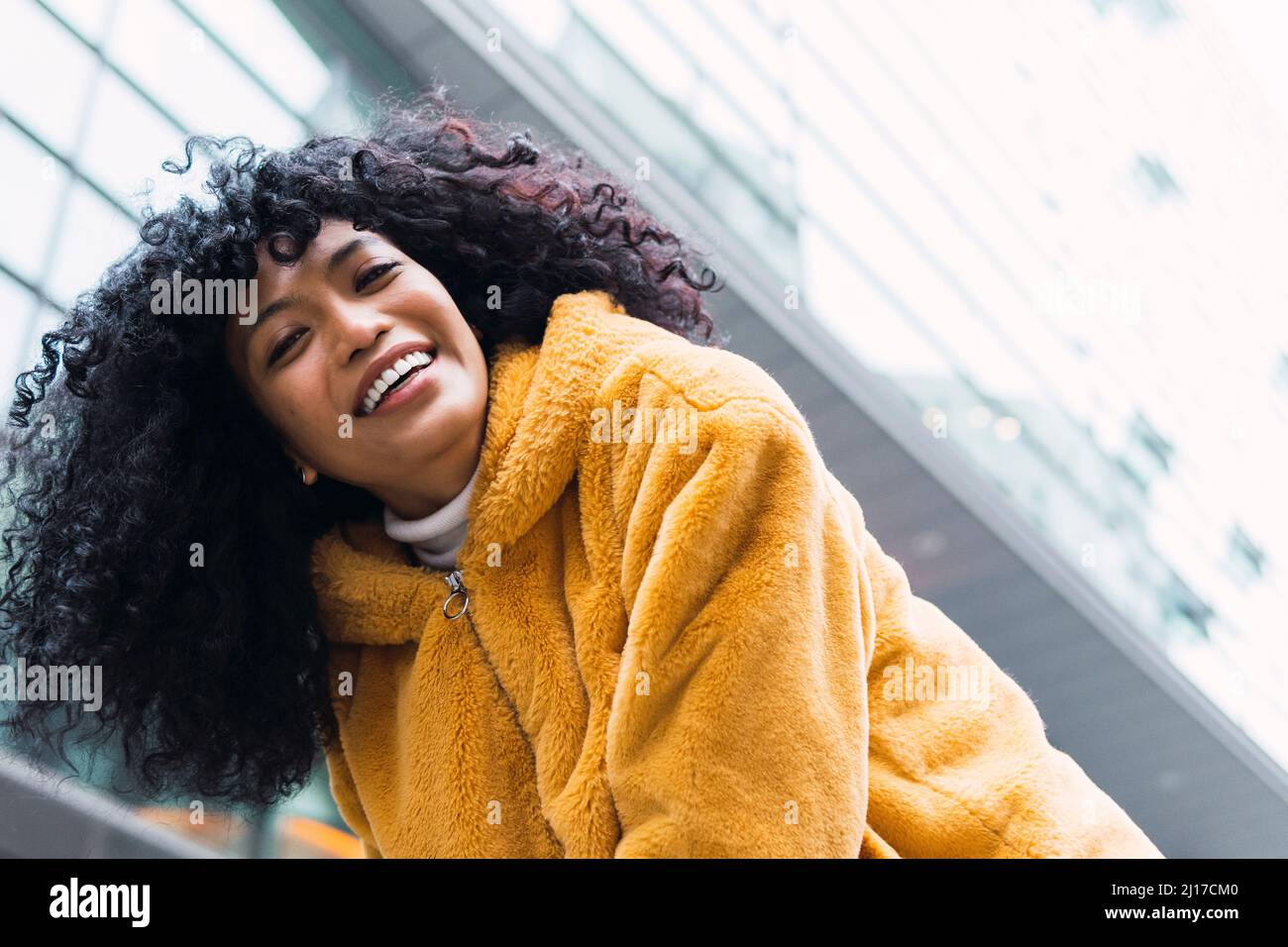 Woman curly hair warm hi-res stock photography and images - Alamy