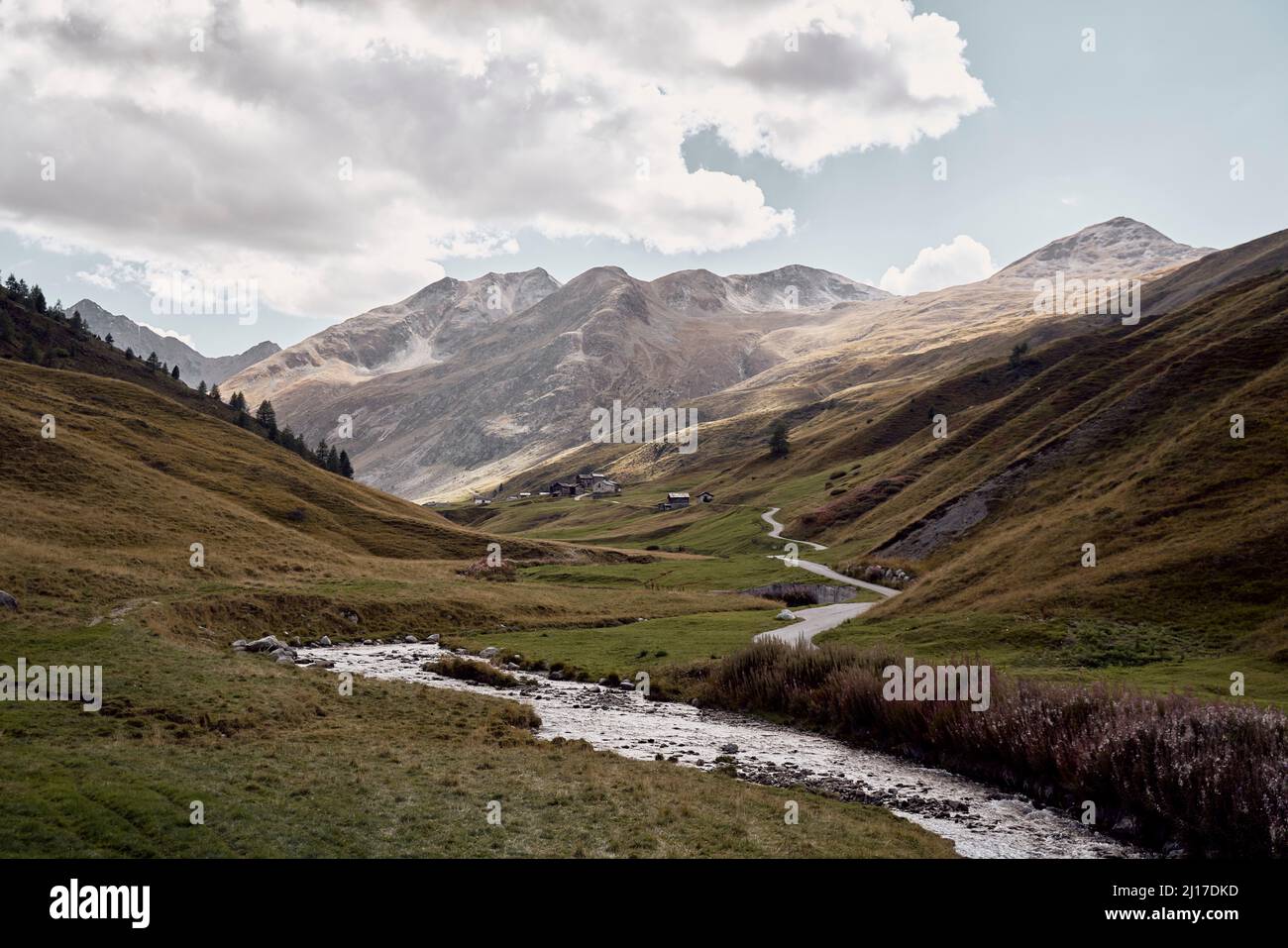 River flowing in stream amidst mountains, Foscagno Pass, Valtellina, Bormio, Italy Stock Photo