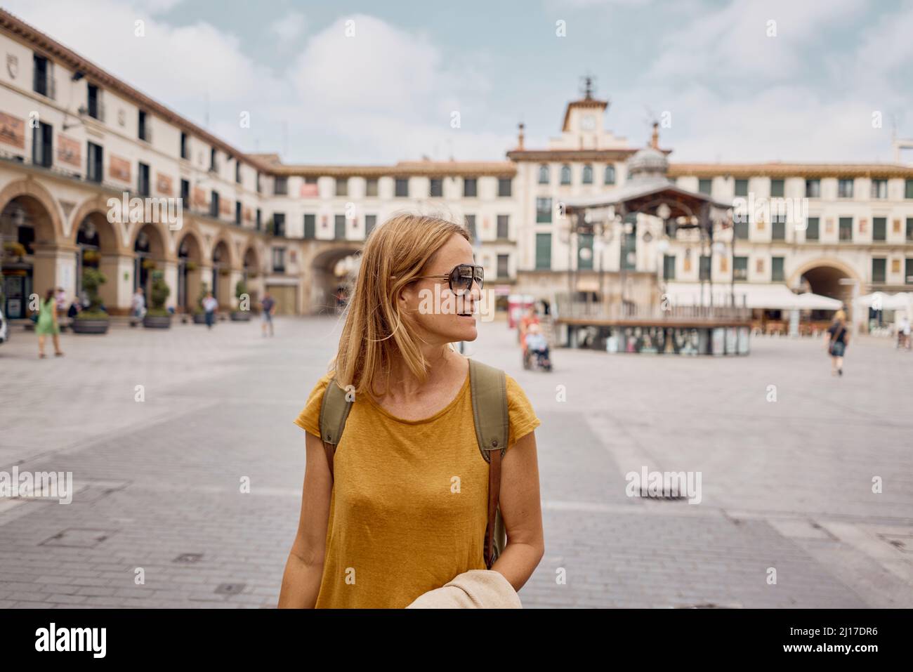 Casual woman standing city square hi-res stock photography and images ...