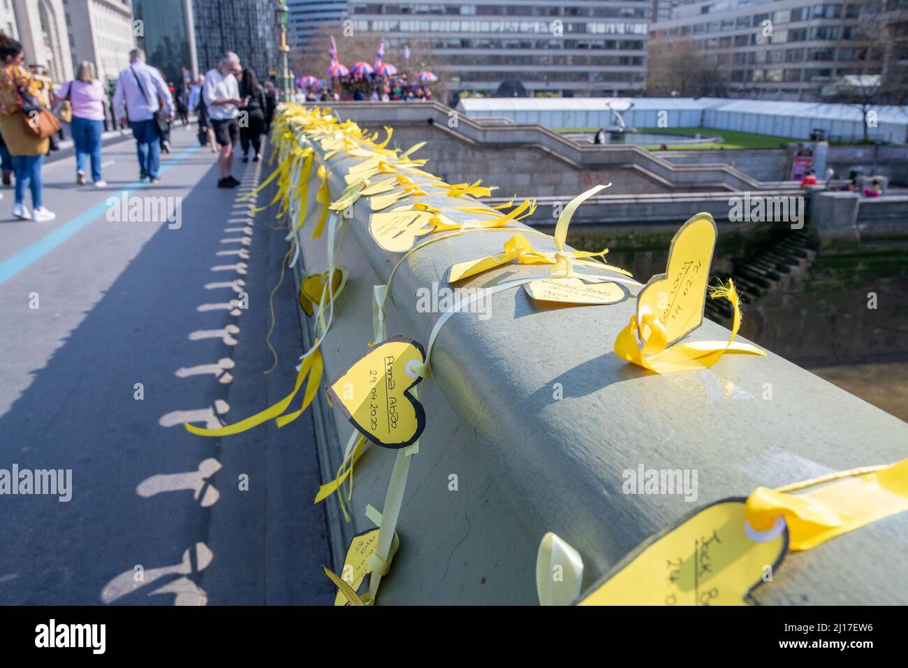 LONDON, MARCH 23 2022, COVID-19 Families for Justice hold a minute silence on Westminster Bridge on the 2nd anniversary of the first lockdown in the UK, so far 160,000 people have died from Coronavirus in the UK. Credit: Lucy North/Alamy Live News Stock Photo