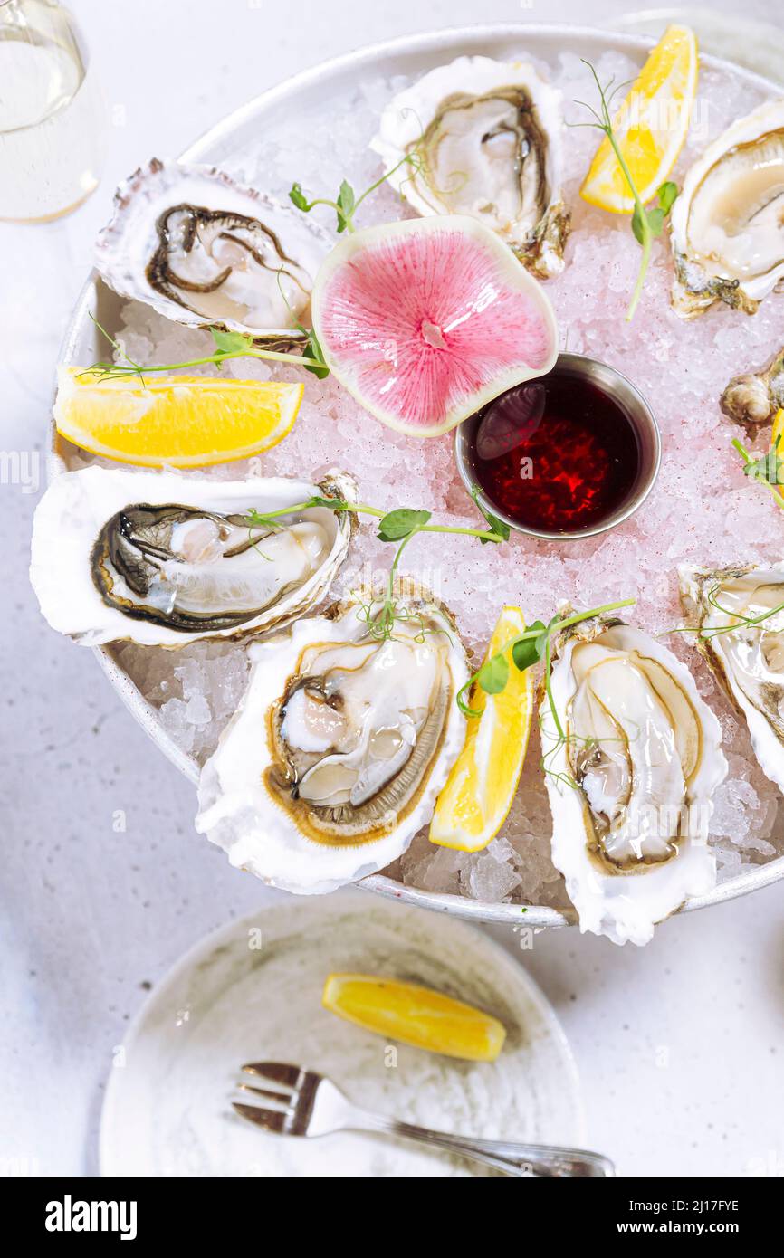 Fresh ready-to-eat oysters on cakestand Stock Photo