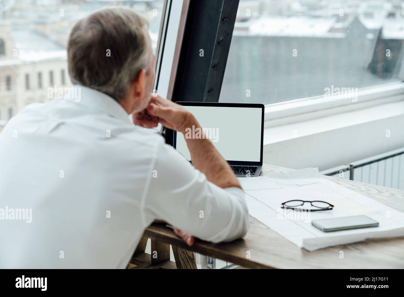 Rear view caucasian businessman using hi-res stock photography and ...