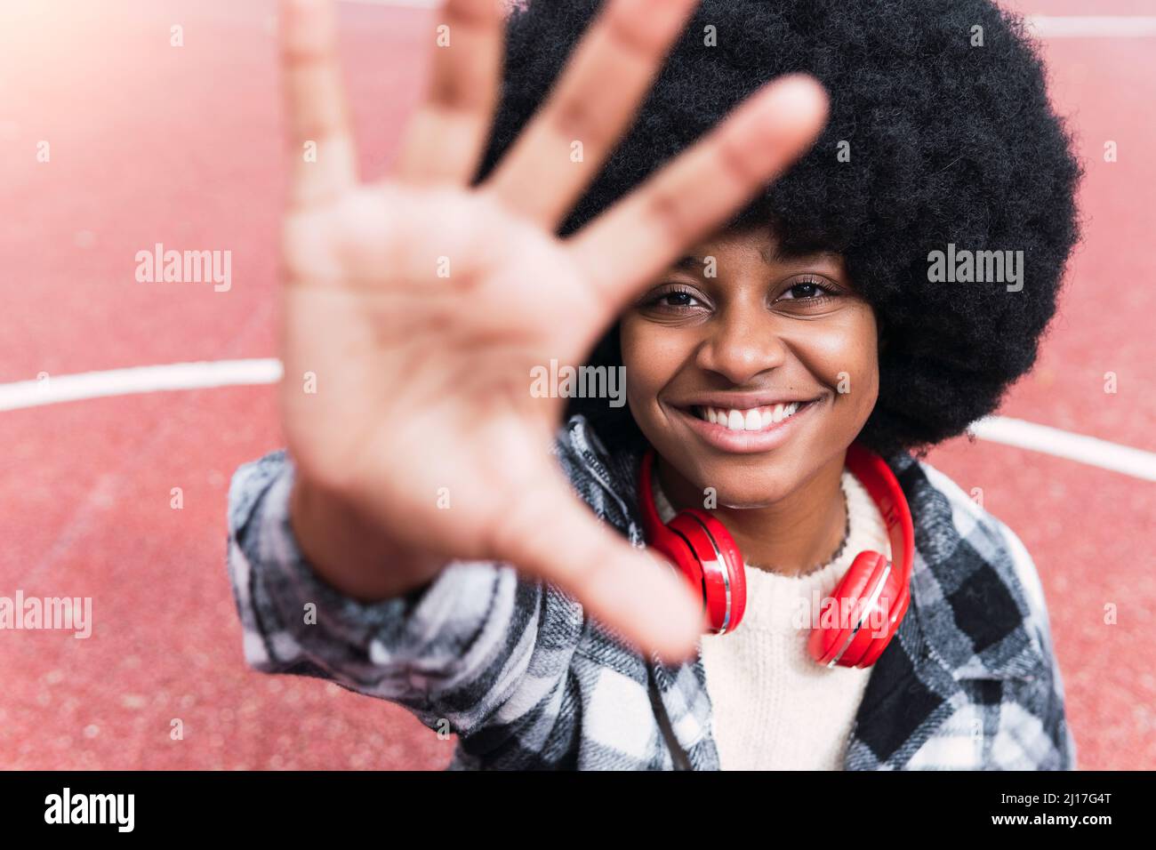 Woman afro hair gesturing hi-res stock photography and images - Alamy