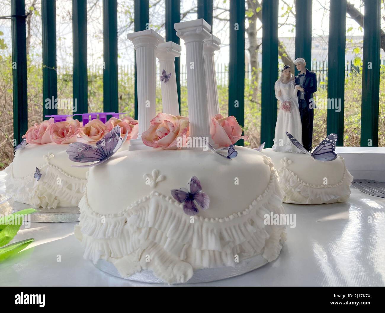 London, UK. 23rd Mar, 2022. A wedding cake for the bride and groom stands on a table outside the prison. Wikileaks founder Assange and his fiancée Moris plan to say 'I do' this Wednesday afternoon at London's maximum security Belmarsh prison. Assange, who is fighting extradition to the U.S. that would see him face up to 175 years in prison, will marry Morris in a ceremony with four guests and two witnesses. Credit: Christoph Meyer/dpa/Alamy Live News Stock Photo