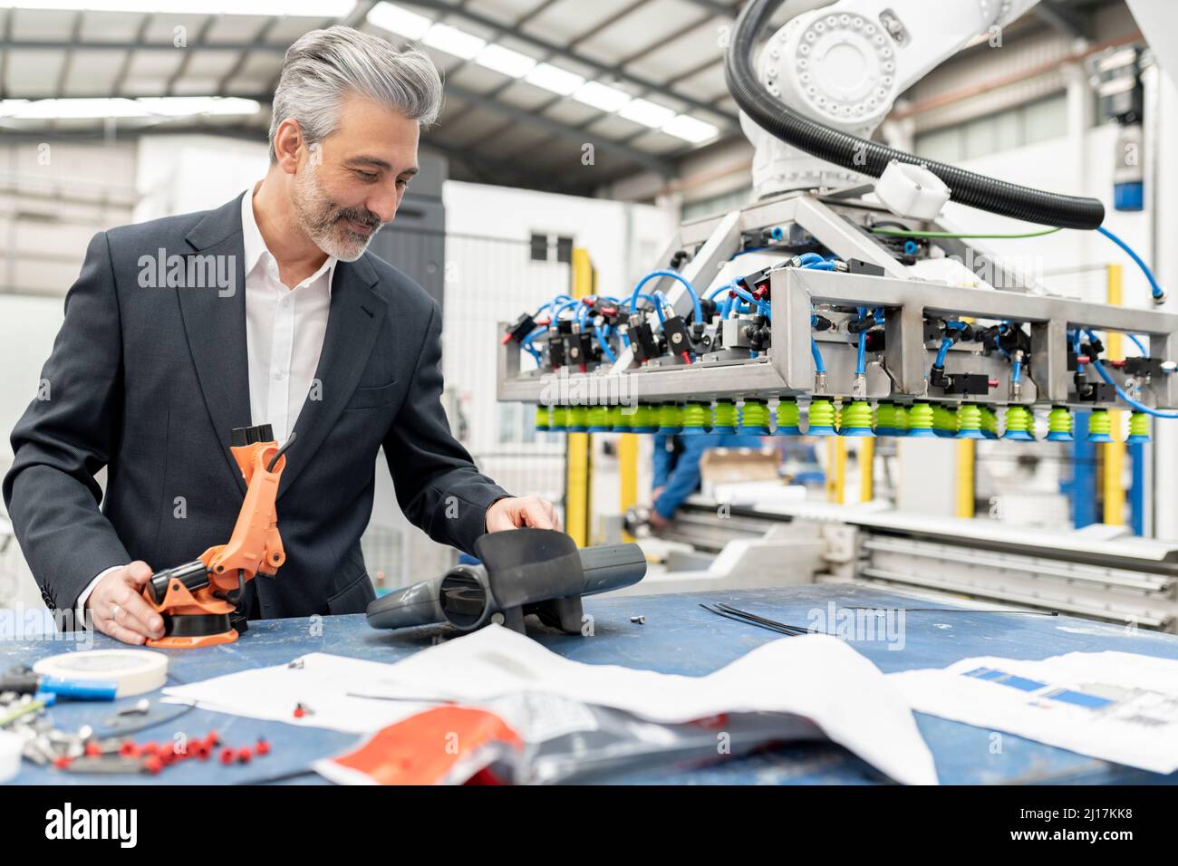 Engineer working with machine parts in factory Stock Photo Alamy