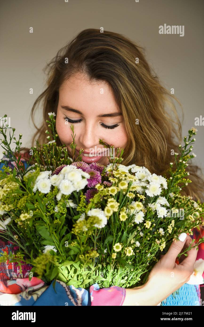 happy-woman-smelling-bouquet-hi-res-stock-photography-and-images-alamy