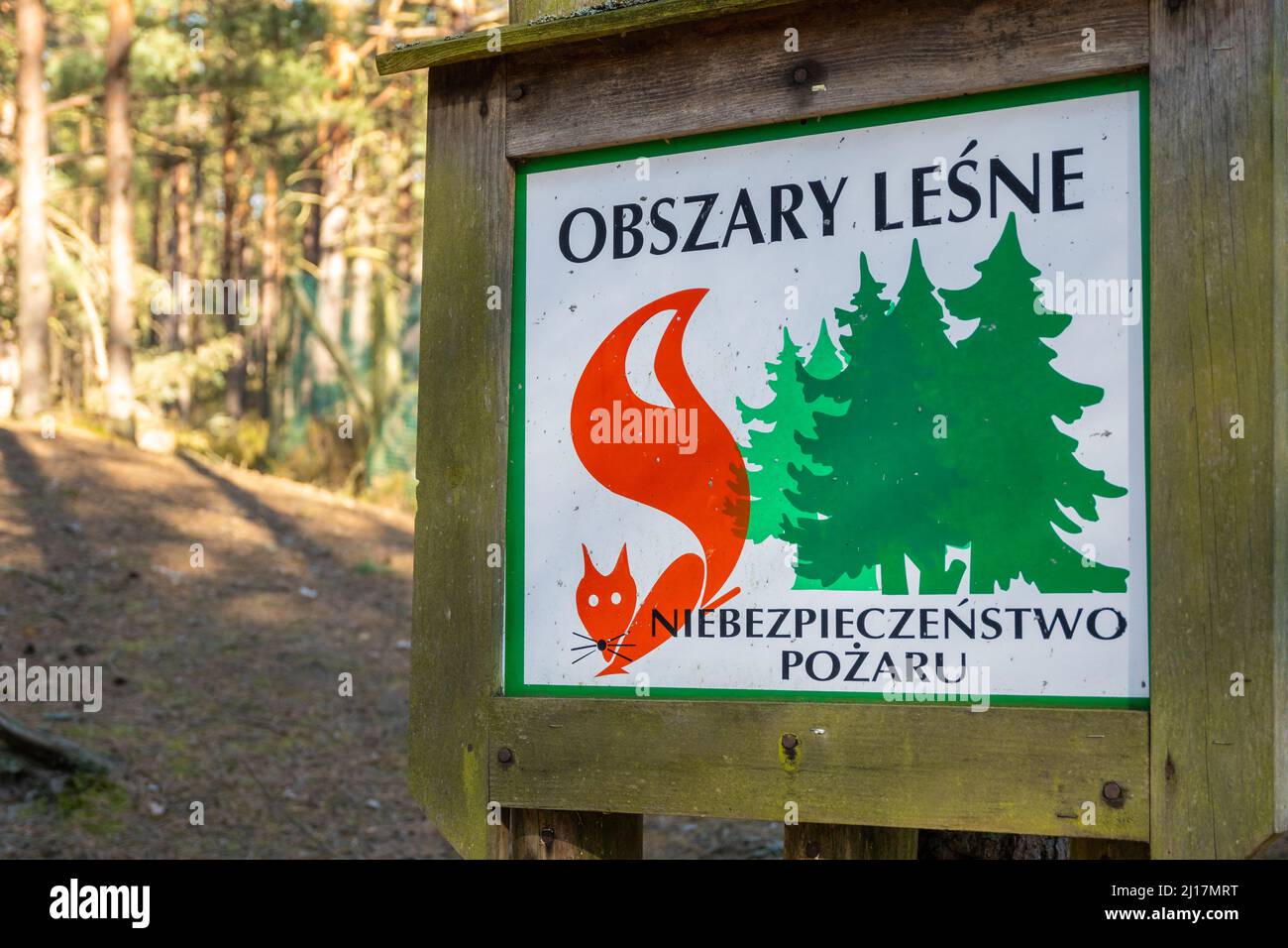 Information sign on a forest in Poland that indicates the risk of ...