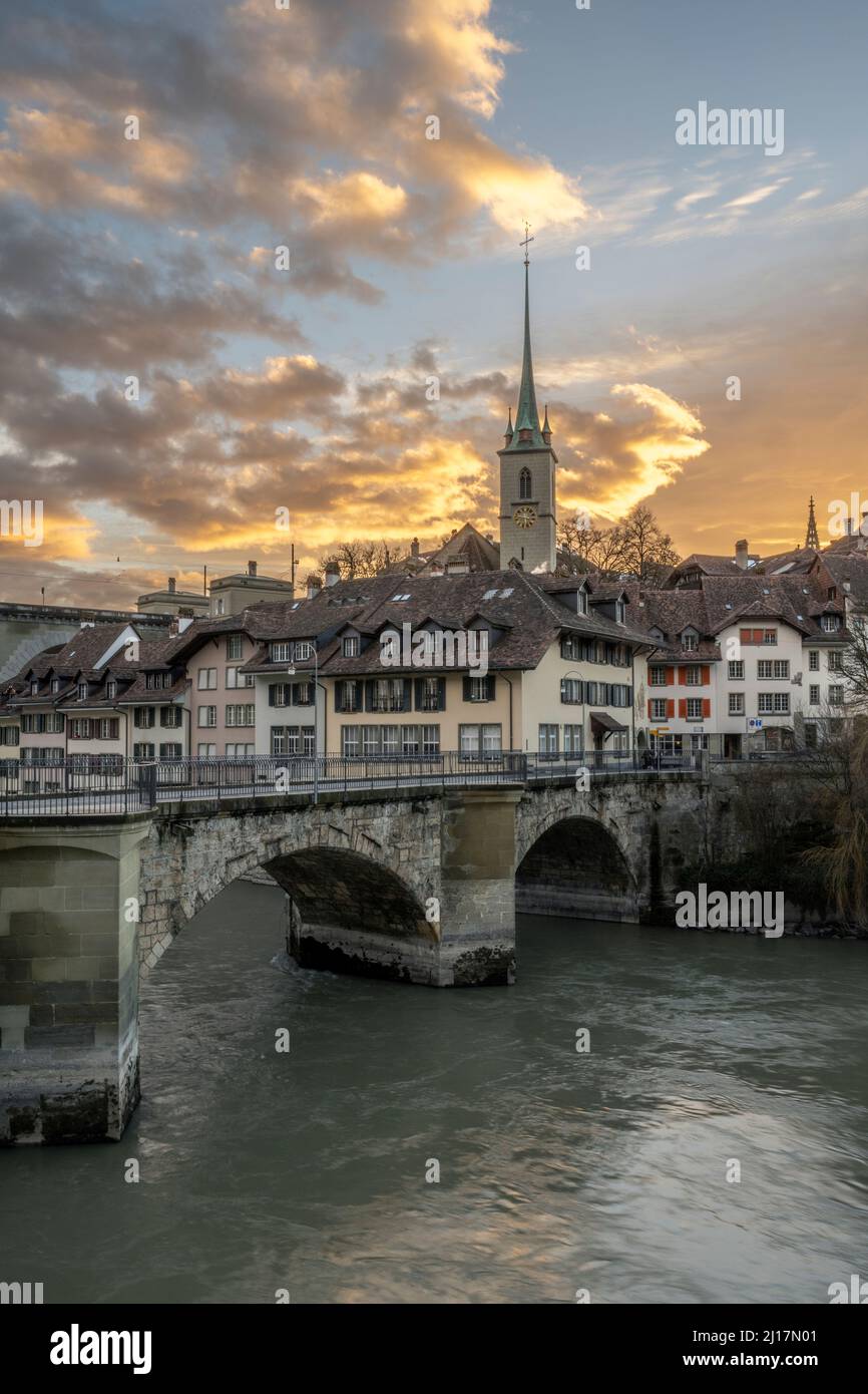Switzerland, Canton of Bern, Bern, Untertor Bridge at dusk with bell tower of Nydegg Church in background Stock Photo