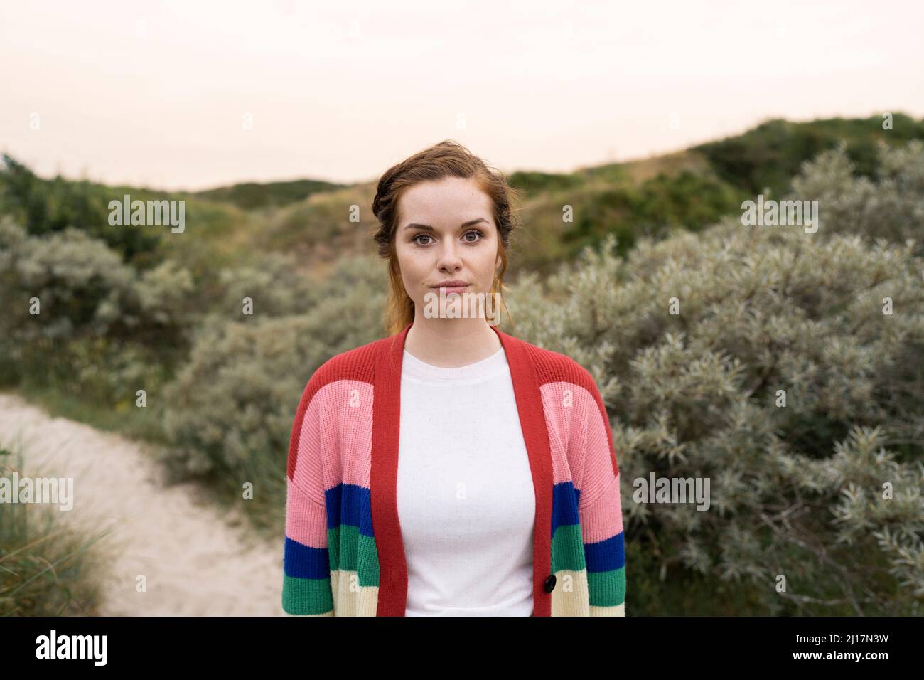 multi colored cardigan sweater standing 