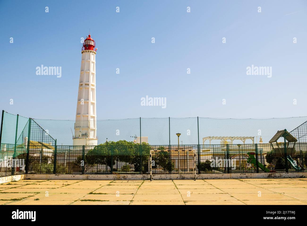 Lighthouse at Farol Island, Faro District, Algarve, Portugal Stock Photo