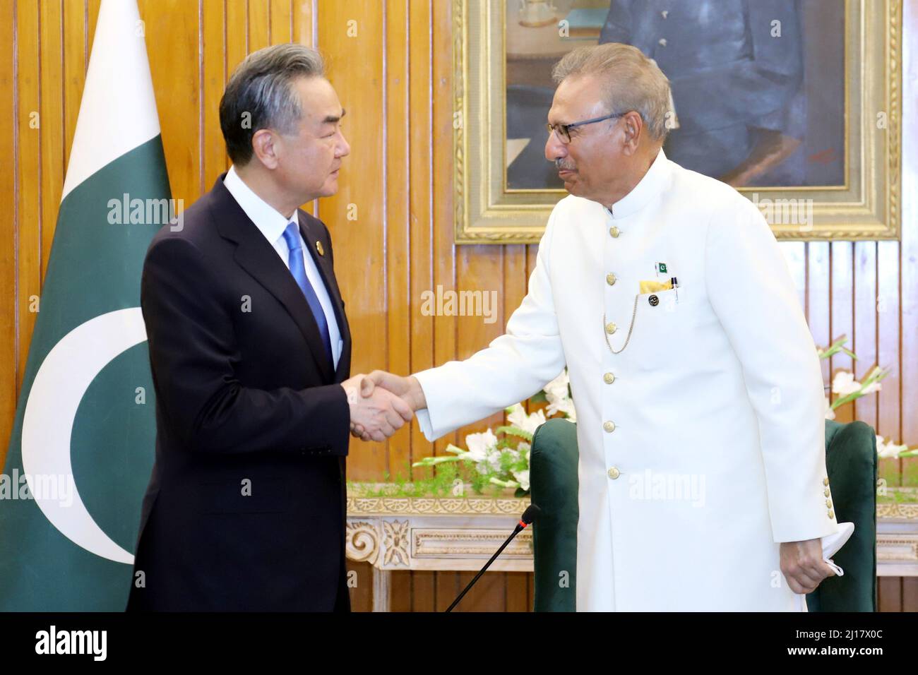 Islamabad, Pakistan. 22nd Mar, 2022. Pakistani President Arif Alvi (R) meets with Chinese State Councilor and Foreign Minister Wang Yi in Islamabad, Pakistan, March 22, 2022. Credit: Jiang Chao/Xinhua/Alamy Live News Stock Photo