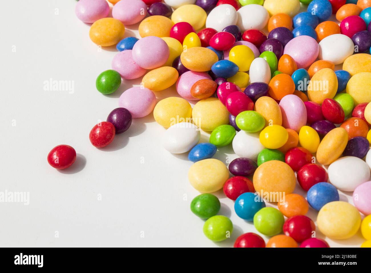 Large group of candies, colorful background, red, blue, yellow, pink